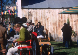 Production crew in downtown Fort Scott, Kansas. Gordon Parks, Jr. (Center) takes a photograph.